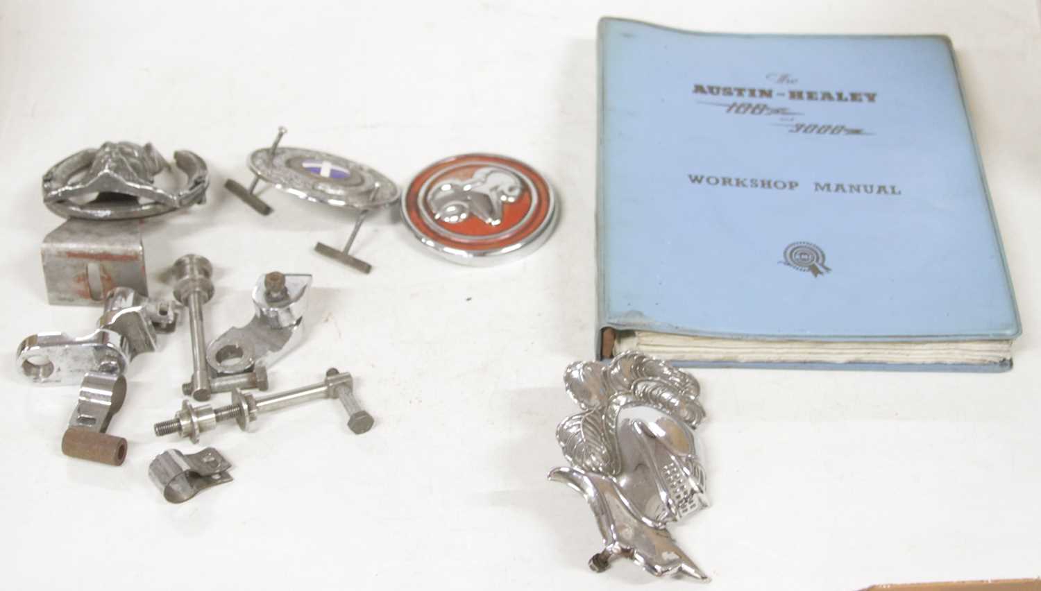 Lot 3055 - A small number of vintage car badges, to...
