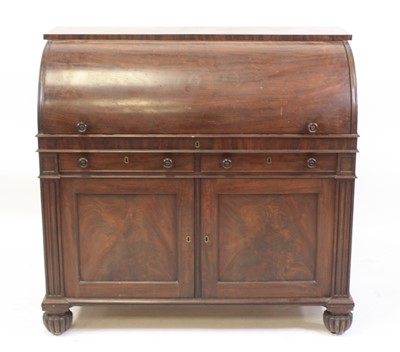 Lot 2414 - A George IV mahogany cylinder desk, having a...