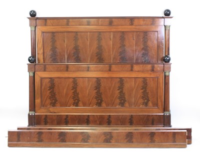 Lot 2402 - A French Empire mahogany double bedstead,...