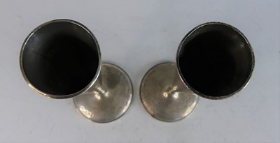 Lot 81 - A pair of circa 1900 silver conical stem vases,...