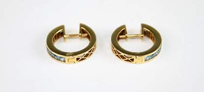 Lot 2162 - A pair of 18ct yellow gold zircon huggy hoop...