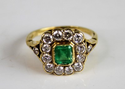 Lot 2158 - A yellow metal, emerald and diamond...