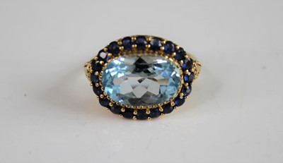 Lot 2141 - A 9ct yellow gold, blue topaz and sapphire...