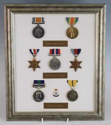 Lot 690 - A family group of medals mounted for display...