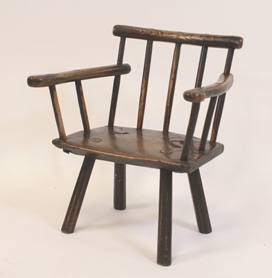 Lot 2464 - An 18th century primitive elm child's chair,...