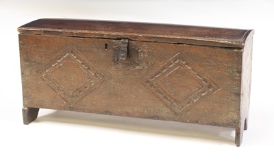 Lot 2393 - A mid-17th century oak plank coffer, the top...