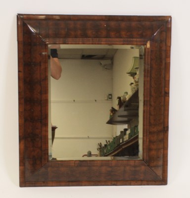 Lot 2475 - An oyster veneered cushion framed wall mirror...