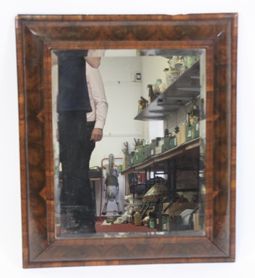 Lot 2476 - An oyster veneered cushion framed wall mirror...