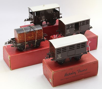 Lot 240 - Four post-war Hornby 0-gauge 4-wheel wagons,...