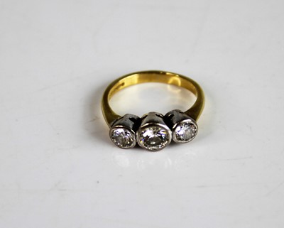 Lot 2172 - An 18ct yellow and white gold diamond...