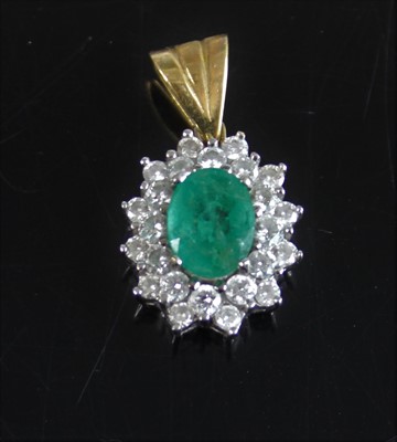 Lot 2171 - A yellow and white metal, emerald and diamond...