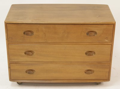 Lot 315 - An Ercol 'Windsor' blond elm chest of three...