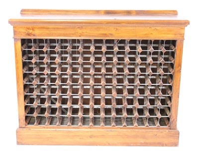 Lot 1535 - A pine freestanding wine rack, having 104...