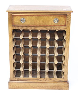 Lot 1538 - An oak and burr oak wine rack, having...