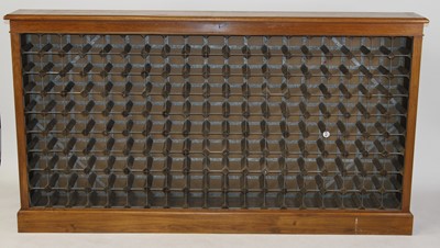 Lot 1539 - A large oak wine rack, having capacity for 171...