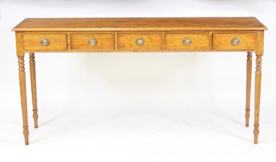 Lot 2471 - An oak five drawer hall table in the Georgian...