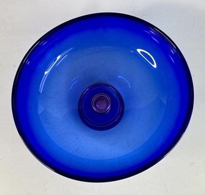 Lot 72 - A large heavy blue glass footed fruit bowl by...