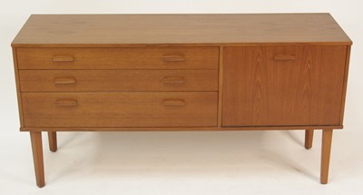 Lot 304 - A 1960s Avalon teak compact sideboard, having...