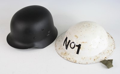 Lot 757 - A reproduction German M 1935 steel helmet with...