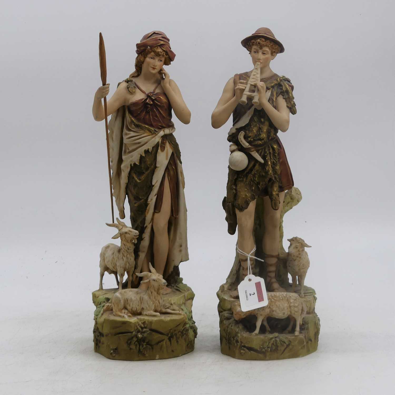 Lot 2 - A pair of Royal Dux figures, each shown in...