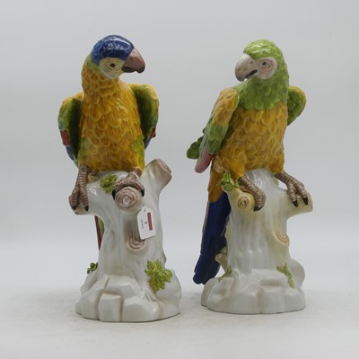 Lot 7 - A pair of porcelain models of parrots, each...