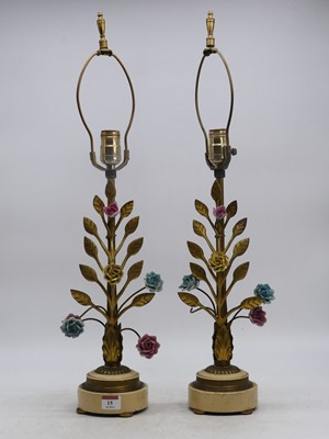 Lot 15 - A pair of gilt metal table lamps, each in the...