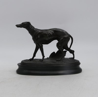 Lot 32 - A spelter model of a greyhound, shown in...