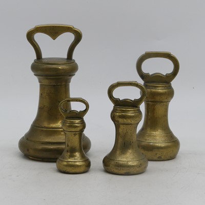 Lot 34 - A set of four graduated brass weights,...