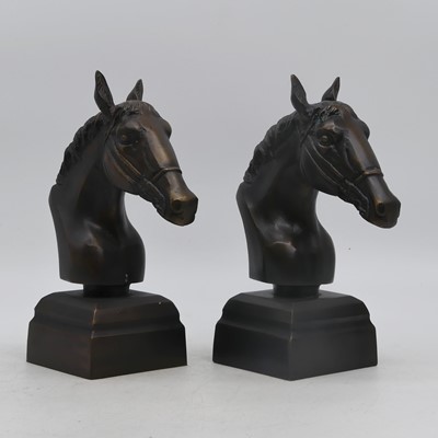 Lot 33 - A pair of cast metal models of horse heads,...
