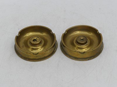 Lot 41 - A pair of brass ashtrays, each constructed...