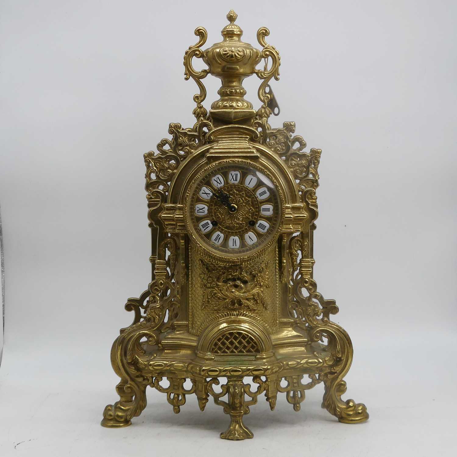 Lot 61 - A 20th century brass cased mantel clock, the...