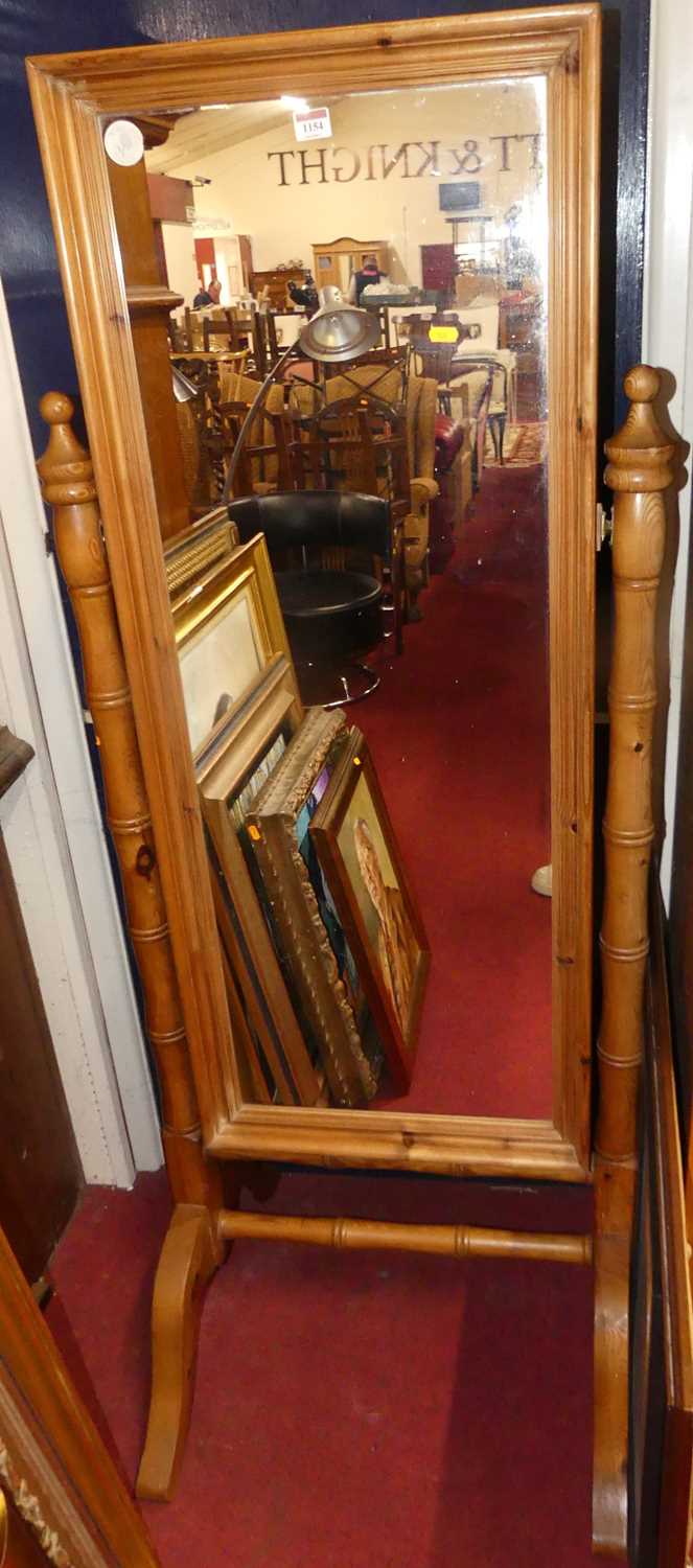 Lot 1154 - A modern pine cheval mirror, raised on bamboo...