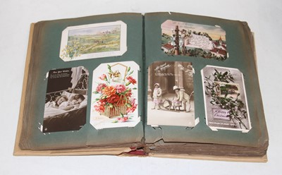 Lot 731 - An Edwardian postcard album and contents to...