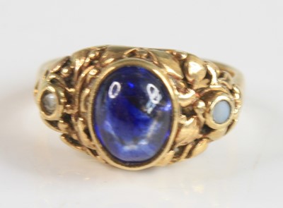 Lot 2233 - A yellow metal sapphire dress ring (tests as...