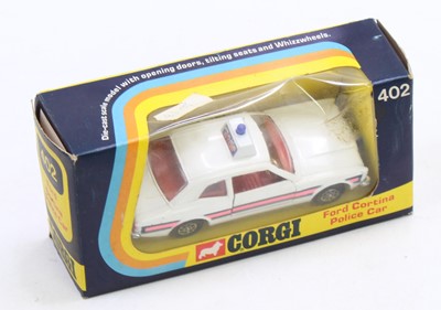 Lot 1387 - A Corgi Toys Whizzwheels No. 402 Ford Cortina...