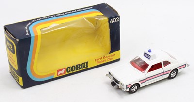 Lot 1387 - A Corgi Toys Whizzwheels No. 402 Ford Cortina...