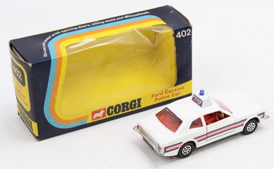Lot 1387 - A Corgi Toys Whizzwheels No. 402 Ford Cortina...