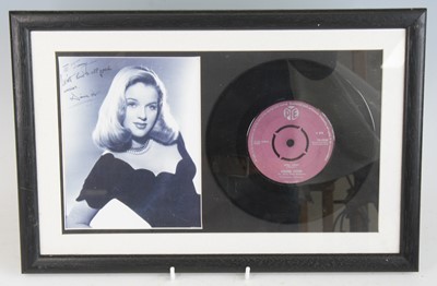 Lot 167 - Diana Dors, an 18 x 14cm black and white...