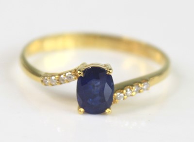 Lot 2235 - A yellow metal sapphire and diamond crossover...