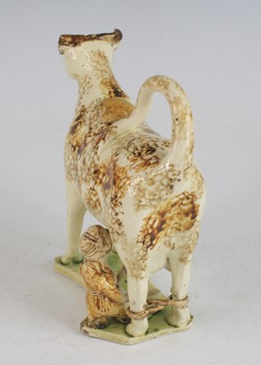 Lot 2071 - A Staffordshire or Yorkshire pearlware cow...