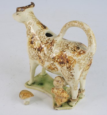 Lot 2071 - A Staffordshire or Yorkshire pearlware cow...