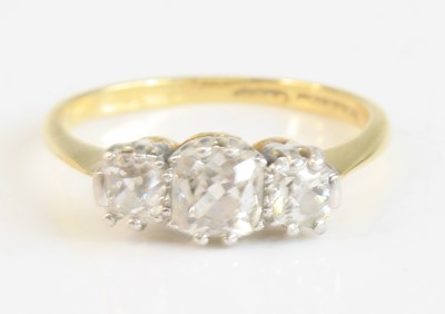 Lot 2275 - A yellow and white metal diamond three-stone...