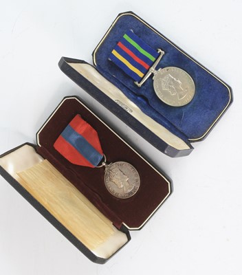 Lot 316 - An E.R. II Civil Defence Long Service medal,...