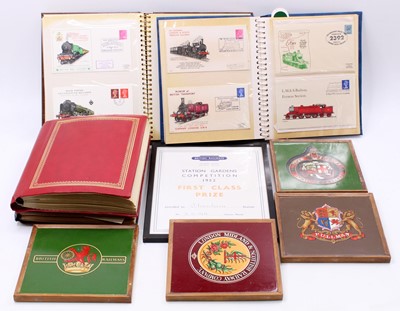 Lot 113 - Four albums containing a quantity of railway...