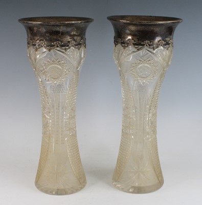 Lot 2122 - A pair of crystal and silver vases, of waisted...