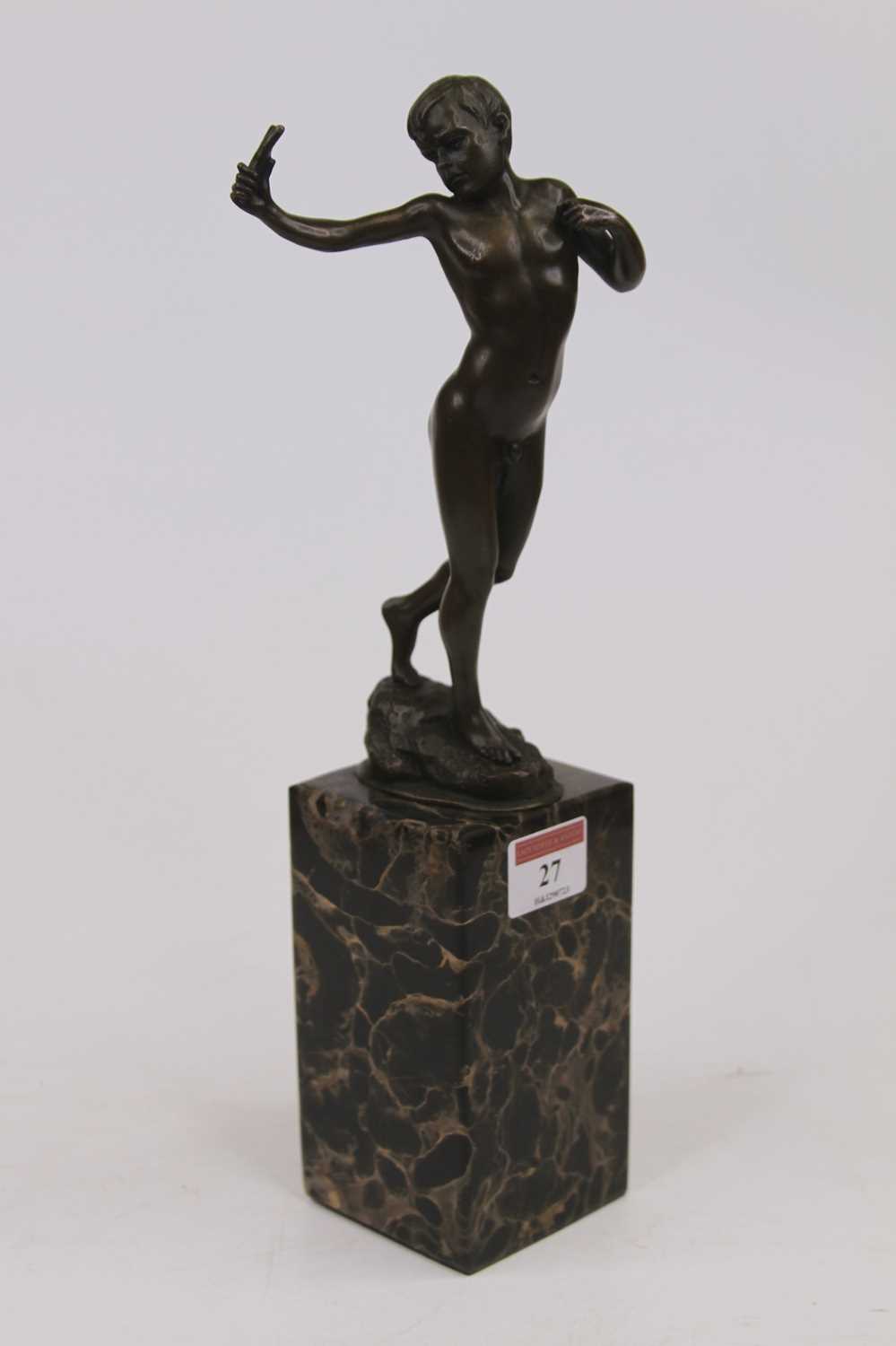 Lot 27 - A reproduction bronzed figure of nude boy in...