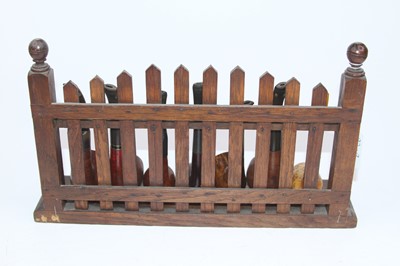 Lot 42 - An early 20th century oak pipe rack in the...