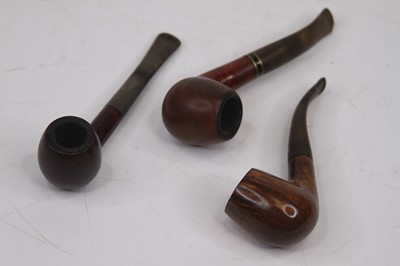 Lot 42 - An early 20th century oak pipe rack in the...
