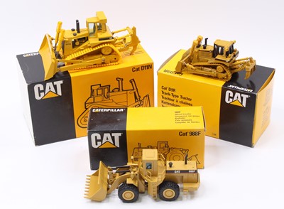 Lot 1690 - An NZG and Conrad boxed 1/50 scale Caterpillar...