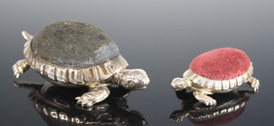 Lot 2199 - Two Edwardian silver novelty pin cushions in...